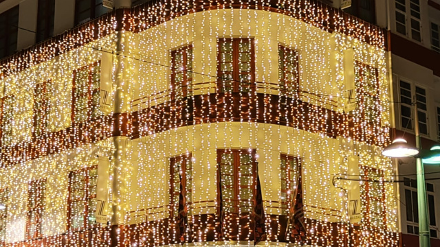 Illuminated building in Callao square